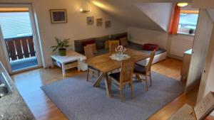 a living room with a table and a couch at Apartment Feichtner in Tulfes