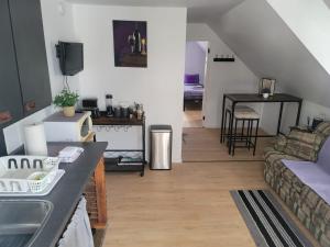 a living room with a couch and a table at Cute apartment close to highway in Edmundston