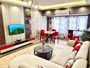 a living room with a couch and a table at Deluxe Apartment Partial Nile View in Cairo