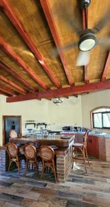 a kitchen with a table and chairs in a room at Rancho Espinoza La Casita in San Ignacio