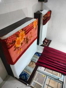 a room with a bed with flowers on it at Hotel Neelkanth in Vrindāvan
