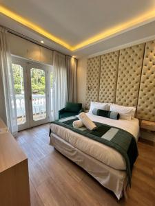 a bedroom with a large bed with a large headboard at Casa D'Agostino in Santiago +27 photos