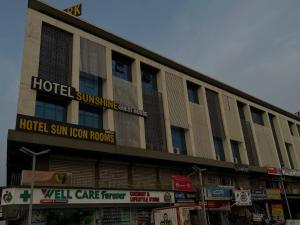 a hotel building with a hotel sum room rooms at Hotel Sun Icon in Vadodara