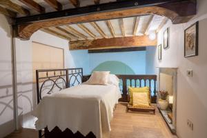 a bedroom with a bed and a fireplace at Palazzo Danesi in Montepulciano