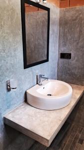 a white sink in a bathroom with a mirror at Villa Sol in Kamburugamuwa +38 photos