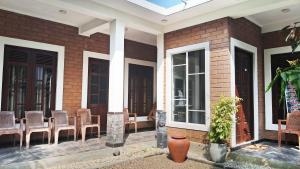 a porch with chairs and a table on a house at Villa Sol in Kamburugamuwa