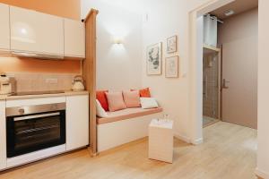 a small kitchen with a couch in a room at Le Spa by SCH in Le Havre