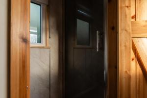 a door to a room with a window and a door at The Truck in Longframlington