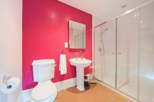 a bathroom with a toilet and a sink and a shower at Old Ford House in Blandford Forum +50 photos