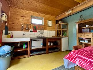 a kitchen with a counter and a sink in a room at Le bon chemin Ateliers in Sainte-Nathalène