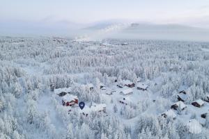 an aerial view of a village covered in snow at Levi Kätkänlinna 20A by Holiday in Lapland in Kittilä