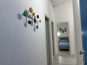 a hallway with a room with a bed and a wall at AZZURRO meraviglioso attico a pochi passi dal mare in Valledoria