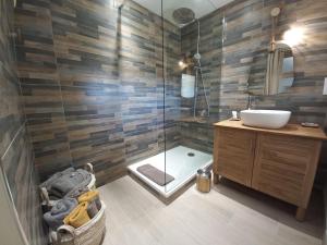a bathroom with a sink and a shower at Domaine la jarrie in La Bussière +22 photos