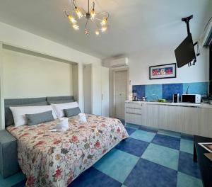 a large bedroom with a bed and a kitchen at Aurora View Resort - Boutique Suites in Mascali +60 photos