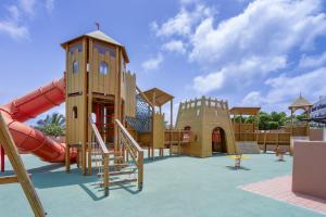 a playground with a slide and a play structure at SOL by Meliá Dunas Family Fun in Santa Maria