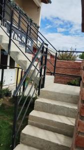 a set of stairs in front of a building at Los del Sur cabañas in Comodoro Rivadavia