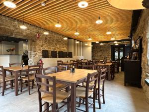 a dining room with wooden tables and chairs at Palacio de Sansol in Sansol +72 photos