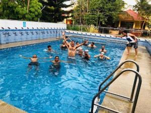 a group of people in a swimming pool at Peters Park in Yelagiri