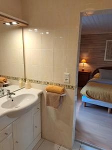 a bathroom with a sink and a bed in a room at Kerioret Izella in Kerlaz +35 photos