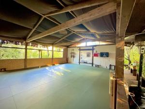 a large room with a blue floor in a building at Penedo Escape Retreat in Colares