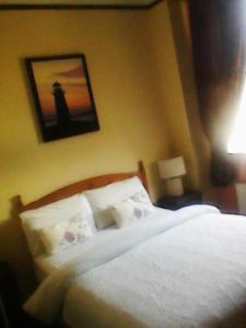 Letto o letti in una camera di Buggle's Pub and Accommodation