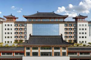 a large building with a chinese roof at Four Points by Sheraton Xi'an Bell Tower in Xi'an