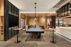 a pool table in the middle of a room at Four Points by Sheraton Xi'an Bell Tower in Xi'an