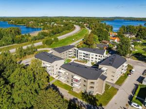 an overhead view of an apartment complex near the water at Bexam Apartment in Växjö