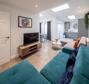 a living room with a couch and a television at Runswick Road in Bristol