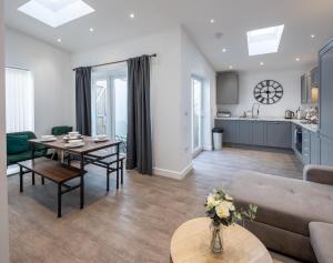 a living room with a table and a couch at Runswick Road in Bristol