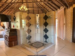 a room with a glass door in a room at Accommodation At Thabong in Brakpan +41 photos