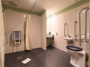a bathroom with a toilet and a sink at B&B HOTEL Birmingham Centre in Birmingham +16 photos