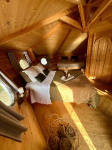 an overhead view of a bedroom in a log cabin at Le Moulin de Trévelo in Caden