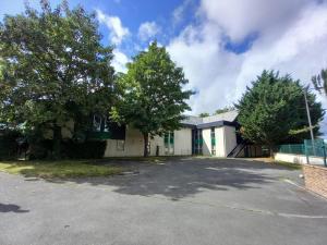 an empty parking lot in front of a building at Mot Hotel in Claye-Souilly