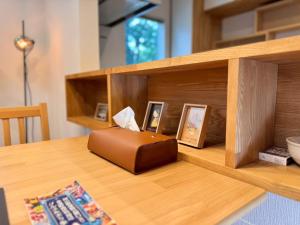 a brown box sitting on top of a wooden table at ura アルコバレーノ奉還町 in Okayama