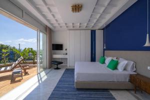 a hotel room with a bed and a balcony at Dar Elyssa in Sidi Bou Saïd