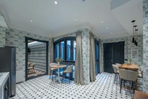 a dining room with a table and chairs at De Domínguez Hotel Boutique in Seville