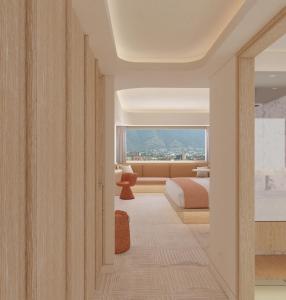 a hotel room with a bed and a window at Hotel Londres in Caracas