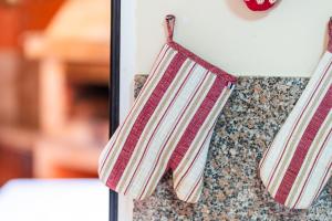 a pair of towels hanging on a wall at GuestReady - Alluring island retreat in Santa Cruz +24 photos