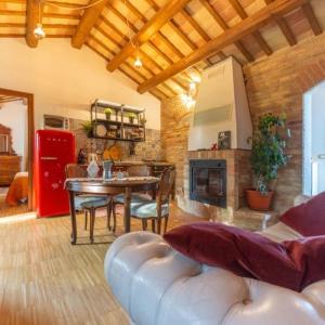 a living room with a couch and a table and a fireplace at Terrazza panoramica, 3 camere e 3 bagni in Collecorvino