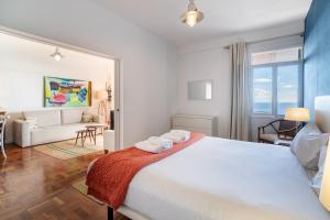 a bedroom with a large bed with towels on it at Lido Mar - Hotels area in Funchal