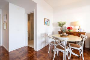 a dining room with a table and chairs at Lido Mar - Hotels area in Funchal