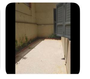 an empty room with a window on the side of a building at Dar Khnata in Temara +3 photos