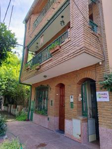 a brick building with two balconies on top of it at Mirador de Nieva in San Salvador de Jujuy