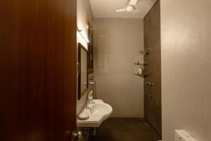 a bathroom with a sink and a toilet in it at Art KOTHI Gurgaon in Gurgaon
