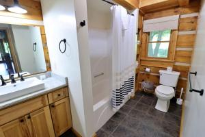 a bathroom with a toilet sink and a shower at The Meadows in Cherokee +40 photos
