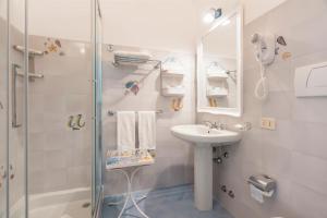 a bathroom with a sink and a shower at Villa La Tartana in Positano