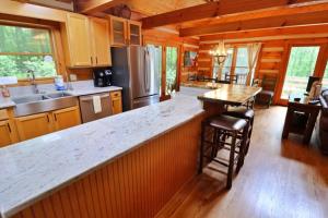 a kitchen with a large counter in a cabin at The Hilltop in Cherokee