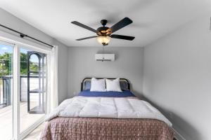 a bedroom with a ceiling fan and a bed at McCormick Retreat in Knoxville