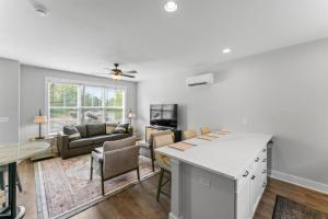 a kitchen and living room with a table and chairs at McCormick Retreat in Knoxville